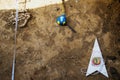 Top view of archaeological instruments north arrow, ruler, compass. Archaeological excavations and finds bones of a skeleton o Royalty Free Stock Photo