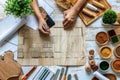 Top view of an architect drawing a sketch of a modern residential building. Workspace of a designer creating a project Royalty Free Stock Photo