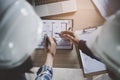 Top view of Architect / Engineer / contractor team brainstorming to design a room layout for project reconstruction house Royalty Free Stock Photo