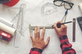 Top View Architect working on blueprint. Architects workplace. Engineer tools and safety control, blueprints, ruler, radio