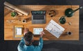 Top view of architect working on computer at desk in home office, video call concept. Royalty Free Stock Photo