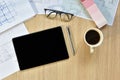 A top view of architect working desk with equipment for drawings pens sketched idea on wood table Royalty Free Stock Photo