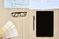 A top view of architect working desk with equipment for drawings pens sketched idea on wood table Royalty Free Stock Photo