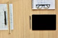 A top view of architect working desk with equipments for drawings pens sketched idea on wood table