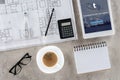 top view of architect workplace with blueprint divider coffee and digital tablet with tumblr