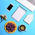 Top view of architectures desk with house laptop cellphone and notebook - Flat lay business concept