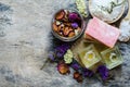 Top view of aroma gel, soap, fragrance flower, and white spa salt on wooden background