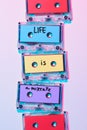 top view of arranged colorful audio cassettes with life is a mixtape inscription