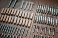 Top view arrangement group of parts dowel, bolt, for furniture assembly on wooden floor. Tools for assembling furniture. D