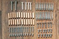 Top view arrangement group of parts dowel, bolt, screw for furniture assembly on wooden floor. Tools for assembling furniture.