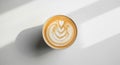 Top view of artistic latte with leaf pattern in sunlight Royalty Free Stock Photo