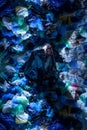 Top view of a artistic picture of a young man in studio, surrounded by empty plastic garbage bags Royalty Free Stock Photo