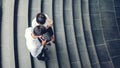 Top view of Asian business people meeting and using digital tablet outdoor after work Royalty Free Stock Photo