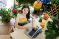 Top view of Asian girl working at home by note book computer in garden Royalty Free Stock Photo