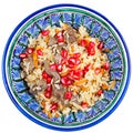 Top view on asian pilaf with pomegranate