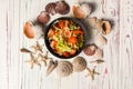 Top view of Thai Salad with beef medallions and fresh vegetables in black plastic Food Delivery bowl with sea shells and stars on Royalty Free Stock Photo