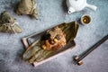 Top view of Asian tasty home made food in dragon boat duan wu festival, rice dumplings or zongzi wrapped by dried bamboo leaves Royalty Free Stock Photo