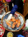 Top view of asian woman selling colourful crabs on a street food market in Vietnam