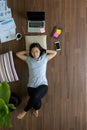 Top view asian women relaxing lying on wooden floor