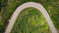 Asphalt road on the hill in Phetchabun province, Thailand. Aerial view from flying drone.