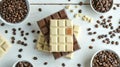 Top view of assorted chocolate bars on a table surrounded by coffee beans. Simple yet elegant. Ideal for culinary blogs Royalty Free Stock Photo