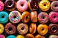 Top view of assorted glazed donuts. . Various colorful glazed doughnuts with sprinkles.