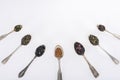 top view of assorted organic herbal tea in spoons