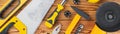 Top view of assorted tools on wooden table banner panoramic