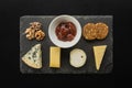 Top view of an assortment of delicious snacks served on a board