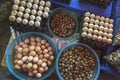 Top view on a assortment of loose eggs on a market, short circuit production