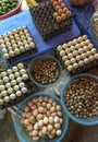 Top view on a assortment of loose eggs on a market, short circuit production