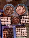 Top view on a assortment of loose eggs on a market, short circuit production