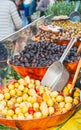 Assortment of prepared foods, grapes, black olives and mushrooms, for sale, at a french farmers market, in rance Royalty Free Stock Photo