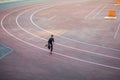 Top view Athlete running on running track. Runner sprinting on red running track in stadium