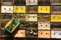 Top view of audio cassettes arranged in rows and columns with cassette player