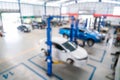 Top view of Auomobile repair, Used engine oil storage tank, with car on electric lift for a car that comes to change the engine