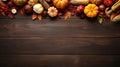 Top view of Autumn background with pumpkins, corn, leaves and berries on wooden table