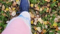 Top of view of autumn season on walking sport shoes in slowmotion. 1920x1080