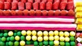 Top view background filled with colorful cakes, desserts, chocolate, and candies