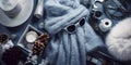 Top-view background with a winter theme showcasing chic winter fashion items, scarves, and accessories