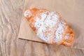 Top view of Baked Tasty croissants on old wooden surface