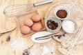 Top View Baking Preparation on wooden Table,Baking ingredients. Bowl, eggs and flour, rolling pin and eggshells on wooden board, Royalty Free Stock Photo