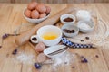 Top View Baking Preparation on wooden Table,Baking ingredients. Bowl, eggs and flour, rolling pin and eggshells on wooden board,