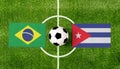 Top view ball with Brazil vs. Cuba flags match on green soccer field