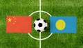 Top view ball with China vs. Palau flags match on green soccer field