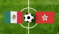 Top view ball with Mexico vs. Hong Kong flags match on green football field Royalty Free Stock Photo