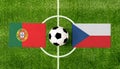 Top view ball with Portugal vs. Czech republic flags match on green football field