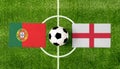 Top view ball with Portugal vs. England flags match on green football field