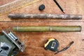 top view bamboo rods cut from wood on a table with tools