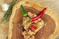 Top view on Barbecue Pork Chop with hot pepper and tomato on a wooden board. CLose up. Selective focus